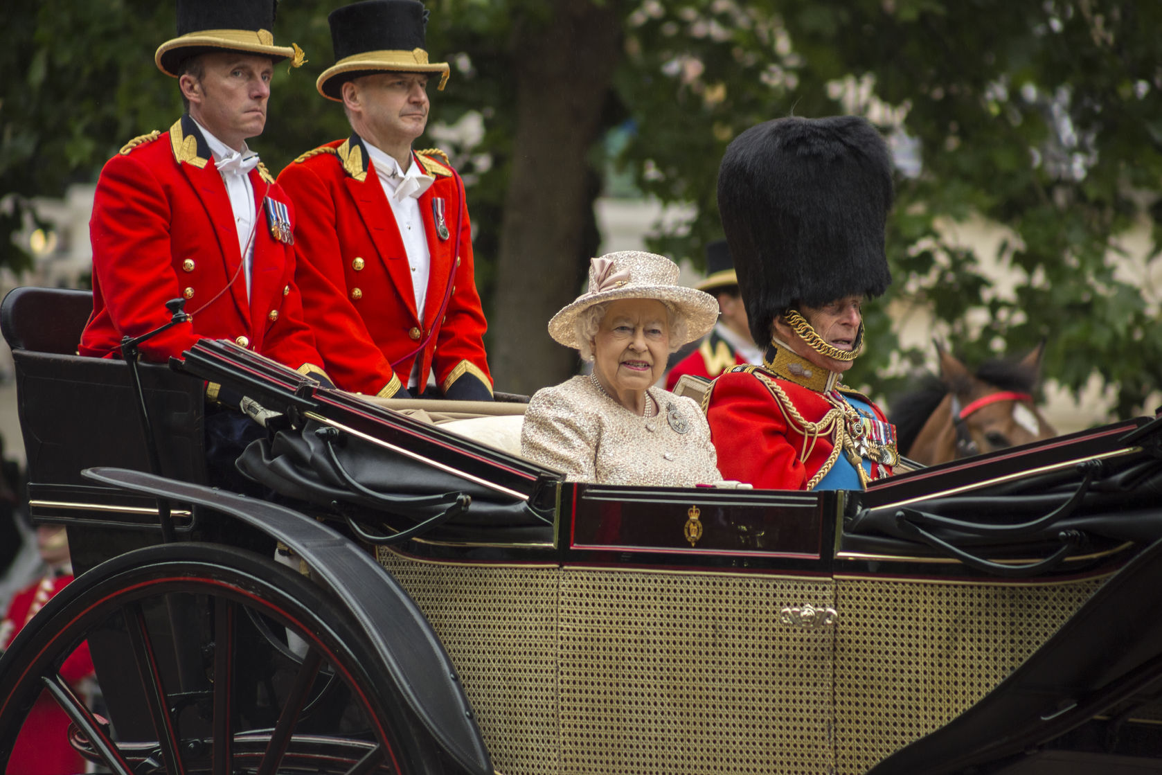 42992148 - queen elizabeth ii in an open carriage with prince philip. trooping the colour 2015 marking the queens official birthday london uk