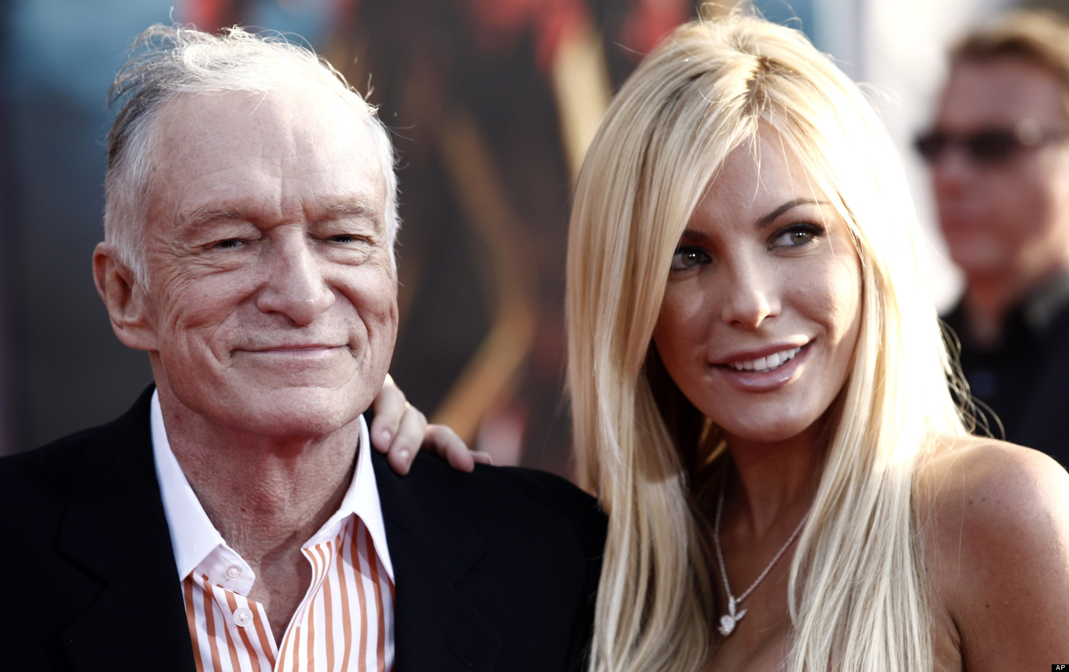 FILE - Hugh Hefner, left, and Crystal Harris arrives at the premiere of "Iron Man 2" at the El Capitan Theatre in Los Angeles in this April 26, 2010 file photo. Hefner says he's gotten engaged again. Hefner said in a Twitter message early Saturday Dec. 24, 2010 that he'd given a ring to girlfriend and Playmate Crystal Harris, saying she burst into tears. (AP Photo/Matt Sayles, File)