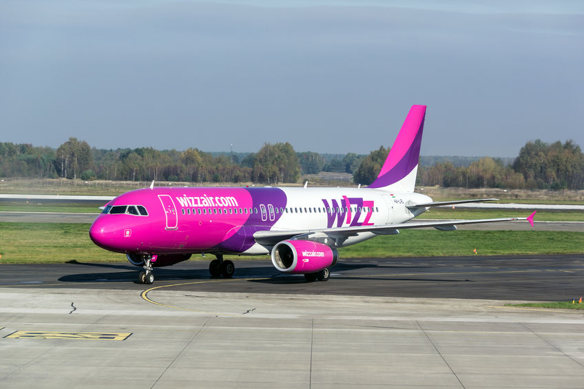 33326975 - katowice, poland - october 25: pink airbus a320-232 aircraft of wizzair company in katowice airport, poland on october 25, 2014: wizzair is a low-cost aerolines company operating through europe.