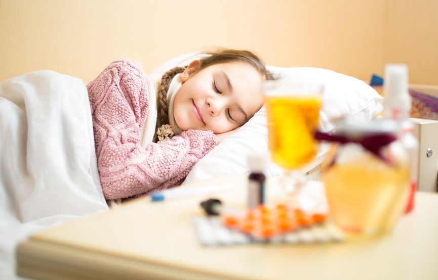 41681422 - portrait of sick girl in woolen sweater lying in bed