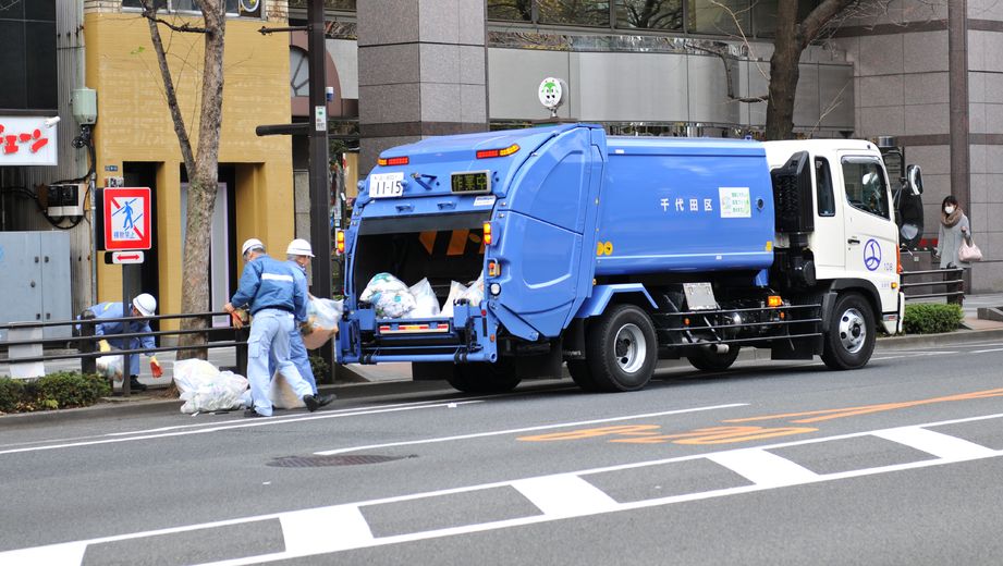 12445426 - tokyo, japan - 28 dec, 2011: garbage truck and salubrity workers on the streets of tokyo