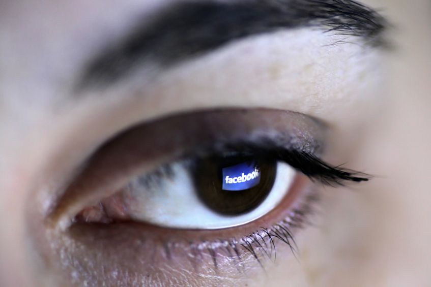 12993602 - bucharest, romania - march 27, 2012: facebook logo is reflected in an eye. facebook is a social networking service launched in february 2004, having more than 845 million active users.