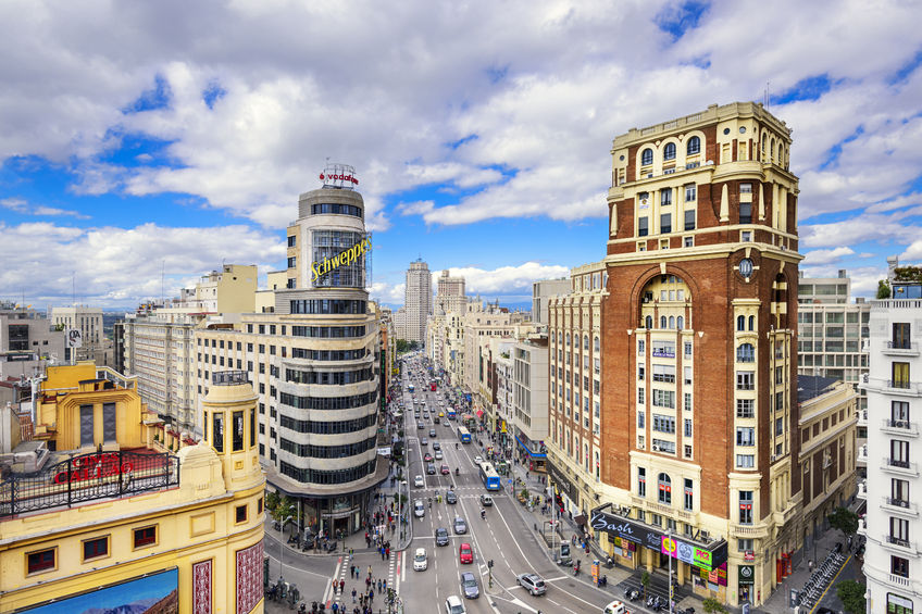 33327001 - madrid, spain - october 15, 2014: gran via at the iconic schweppes building. the street is the main shopping district of madrid.