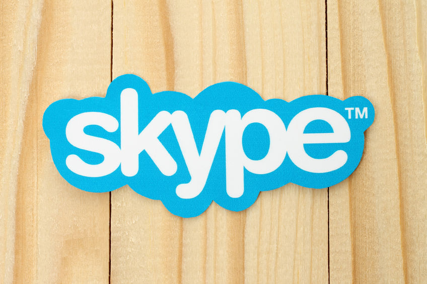 37759424 - kiev, ukraine - february 19, 2015: skype logotype printed on paper and placed on wood background. skype is a telecommunications application software developed by microsoft.