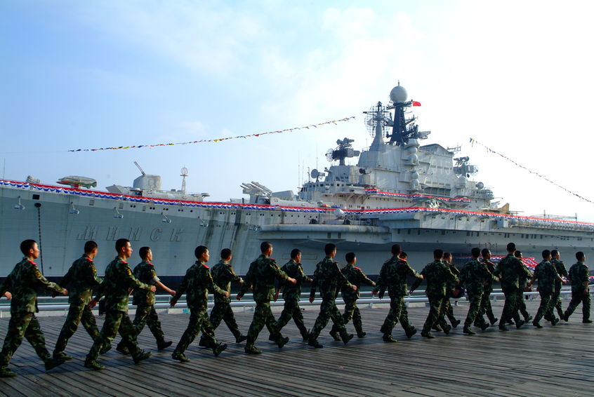 41482524 - warship in the bay and chinese soldier training.