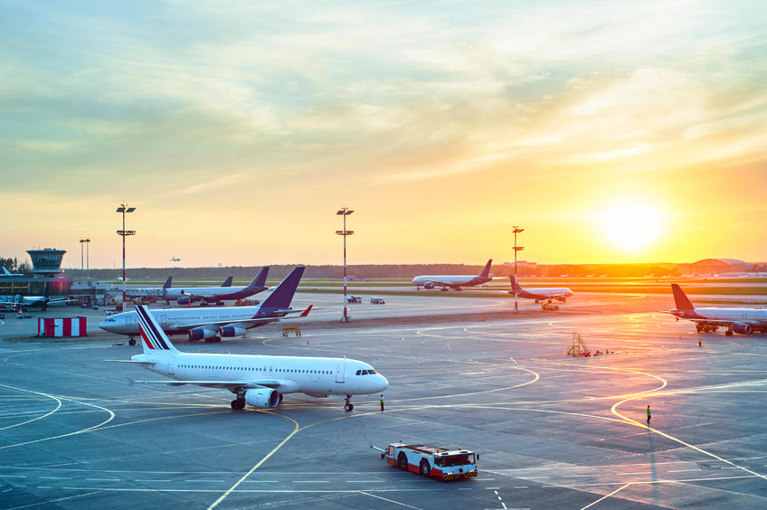 43512798 - airport with many airplanes at beautiful sunset