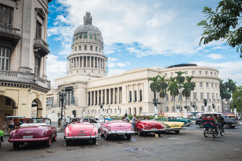 45850244 - havana, cuba - september 22, 2015: classic american car and capitolio landmark in havana,cuba. havana is tourist most popular destination in whole cuba island.