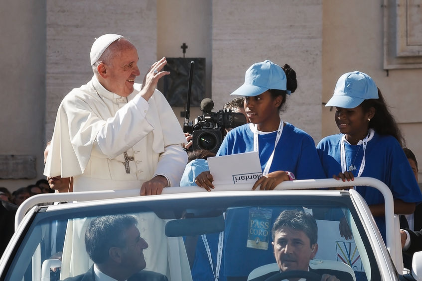 62234476 - vatican state - september 3, 2016: pope francis on the new convertible car, waving to the crowd of faithful gathered in st. peter's square for the sanctification of mother teresa of calcutta.