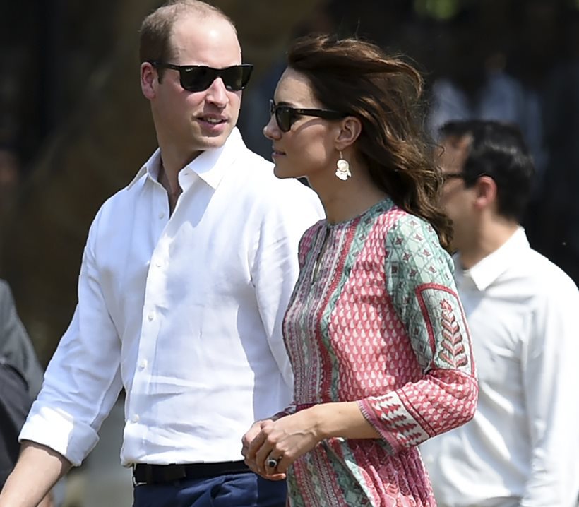 The Duke and Duchess of Cambridge, Prince William, and his wife, the former Kate Middleton walk during a charity event at the Oval Maidan in Mumbai, India, Sunday, April 10, 2016. The royal couple began their weeklong visit to India and Bhutan, by laying a wreath at a memorial Sunday at Mumbais iconic Taj Mahal Palace hotel, where 31 victims of the 2008 Mumbai terrorist attacks were killed. (Indranil Mukherjee /Pool via AP)