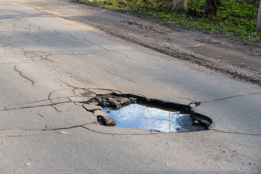 40460819 - road hole. repair work grey asphalt puddle