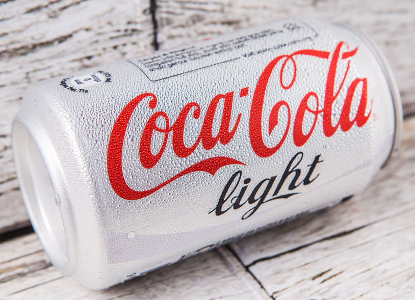 42009511 - putrajaya, malaysia - july 5th, 2015. coca cola light on weathered wood. coca cola drinks are produced and manufactured by the coca-cola company, an american multinational beverage corporation.