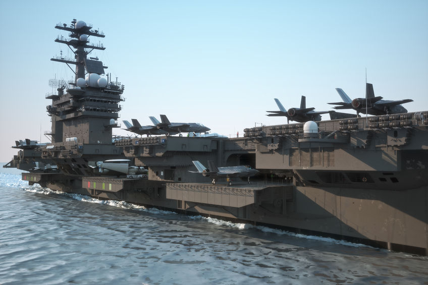 43692167 - navy aircraft carrier angled view, with a large compartment of aircraft and crew.