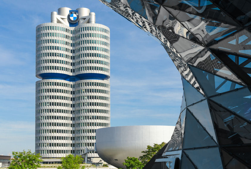 43723250 - munich, germany - september 28, 2014: bmw four-cylinder tower is a munich landmark which serves as world headquarters for the bavarian automaker. stock photo with elements of designs of bmw museum and bmw welt (world).