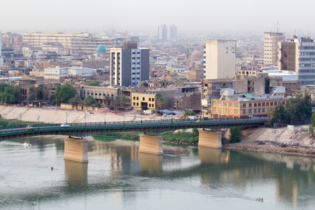 46306665 - aerial photo of the city of baghdad, and shows where residential complexes and the tigris river and bridges. the city of baghdad, capital of iraq.