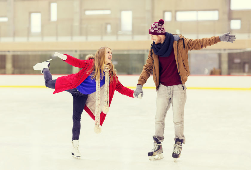 47664063 - people, friendship, sport and leisure concept - happy couple holding hands on skating rink