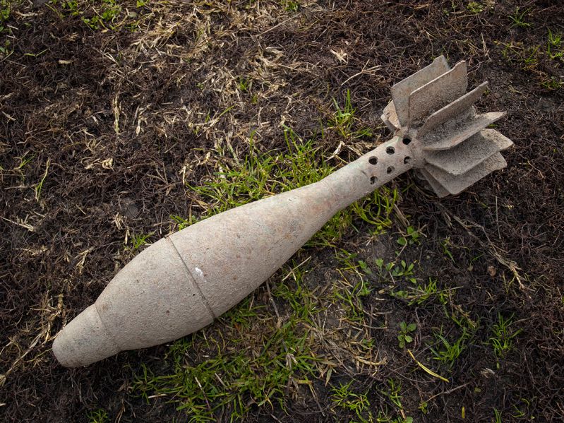 16576532 - old unexploded mortar shell grenade on the ground.