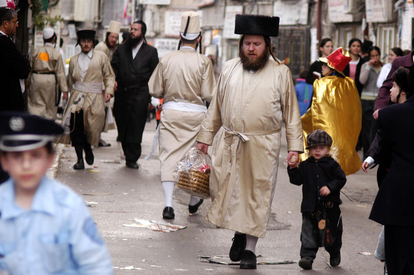 46309452 - jerusalem - march 15: ultra-orthodox jewish people celebrates the jewish holiday purim on march 15 2006 in mea shearim in jerusalem, israel.