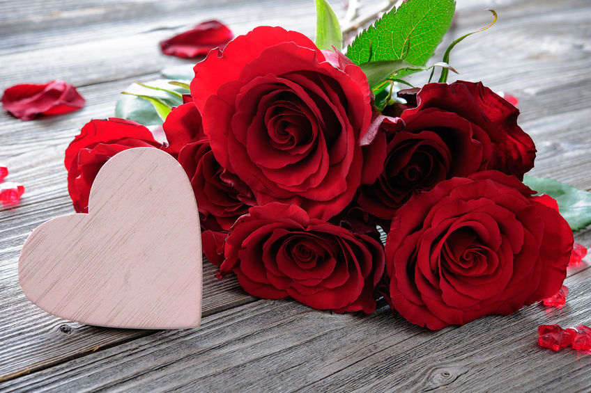 50773447 - red roses and heart on wooden background. valentines day background
