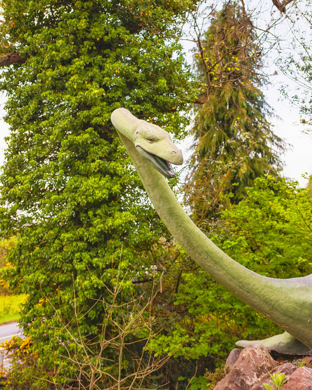 55062872 - drumnadrochit, scotland - may 9, 2011: nessie, loch ness monster statue in loch ness in scotland. loch ness is a city in the highlands in scotland in the united kingdom.