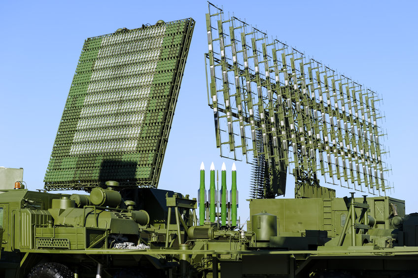68417069 - air defense radars of military mobile antiaircraft systems in green color and ballistic rocket launcher with four cruise missiles in centre of frame, modern army industry