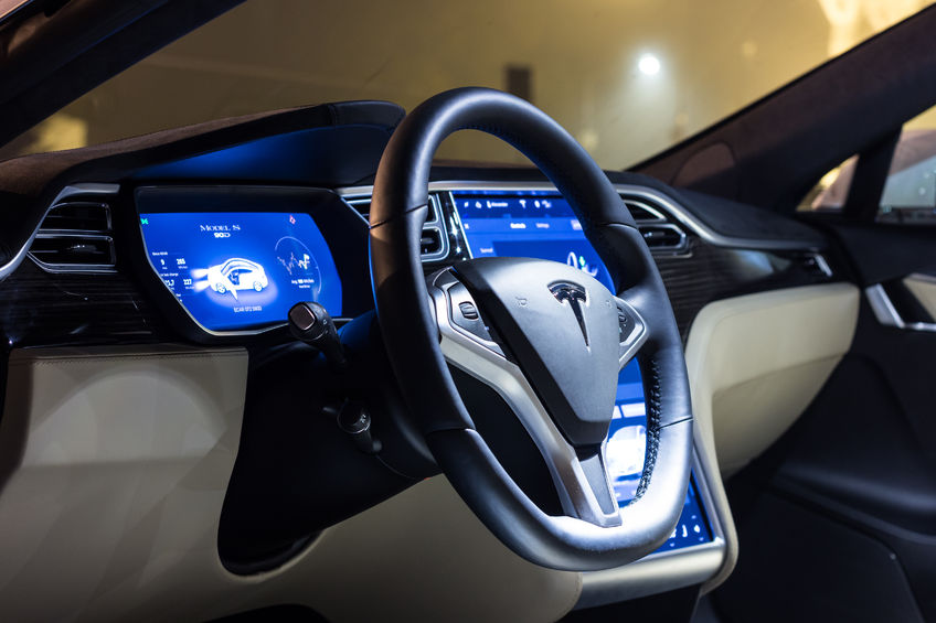 68771042 - ljubljana, slovenia - october 13, 2016: the interior of a tesla model s electric car with steering wheel and dashboard at night