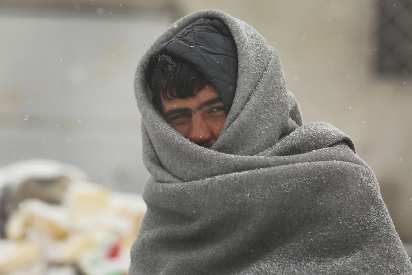 69201042 - belgrade, serbia - january 10, 2017: migrant mostly from afghanistan and pakistan, have occupied an abandoned customs warehouse in belgrade in freezing temperatures waiting for a chance to move forward toward the european union.