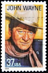 10419728 - usa - circa 2004: a stamp printed in united states of america shows famous american movies western actor john wayne, circa 2004