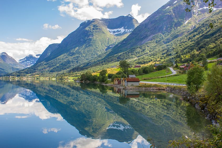 19289905 - scenic norway with mountain backdrop reflecting in the fjord water