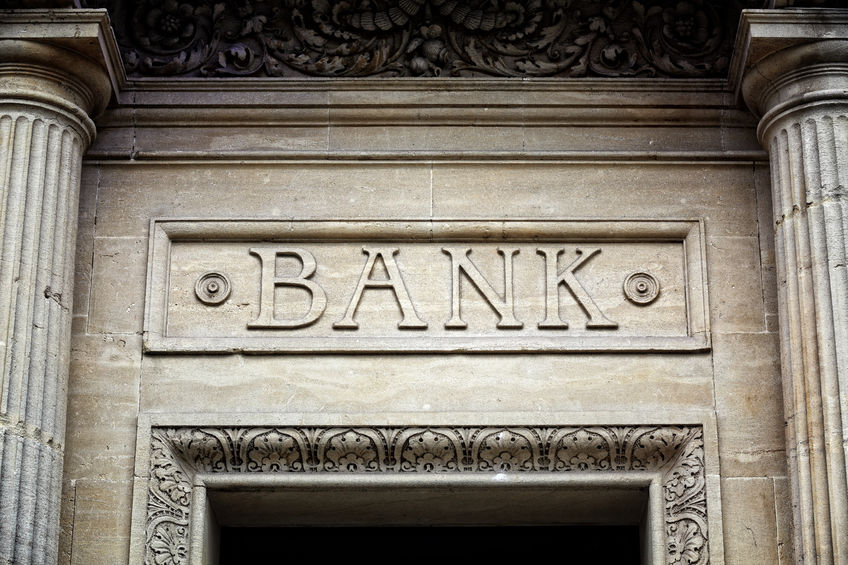 41818583 - old bank sign engraved in stone or concrete above the door of financial building concept for finance and business