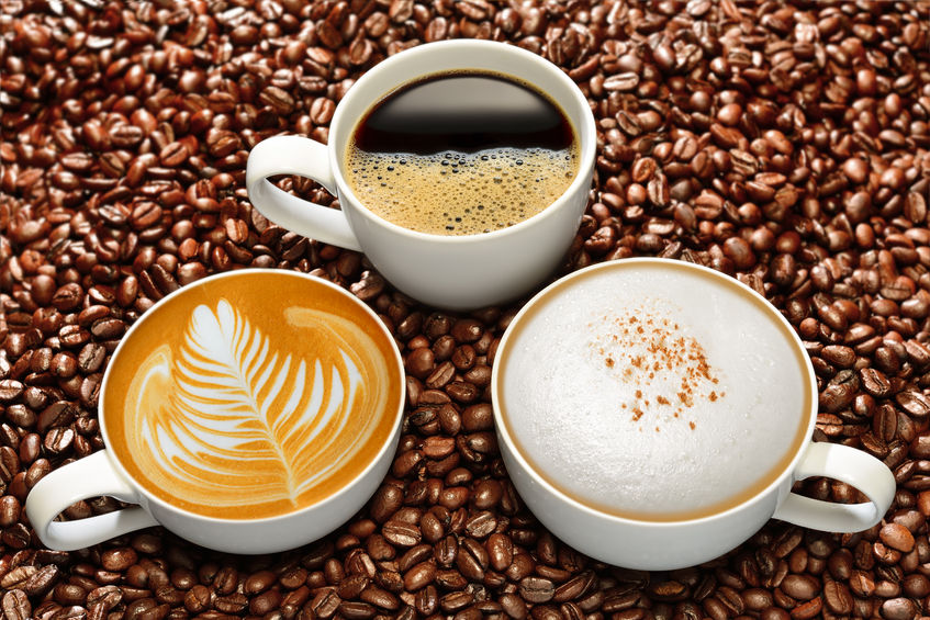 42528010 - variety of cups of coffee on coffee beans background
