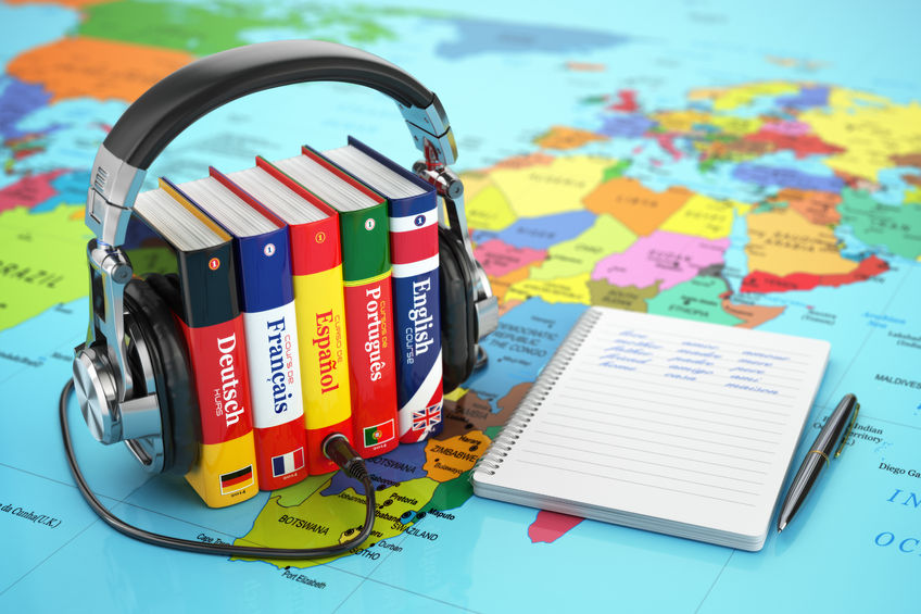 48592459 - learning languages online. audiobooks concept. books and headphones on the map world. 3d