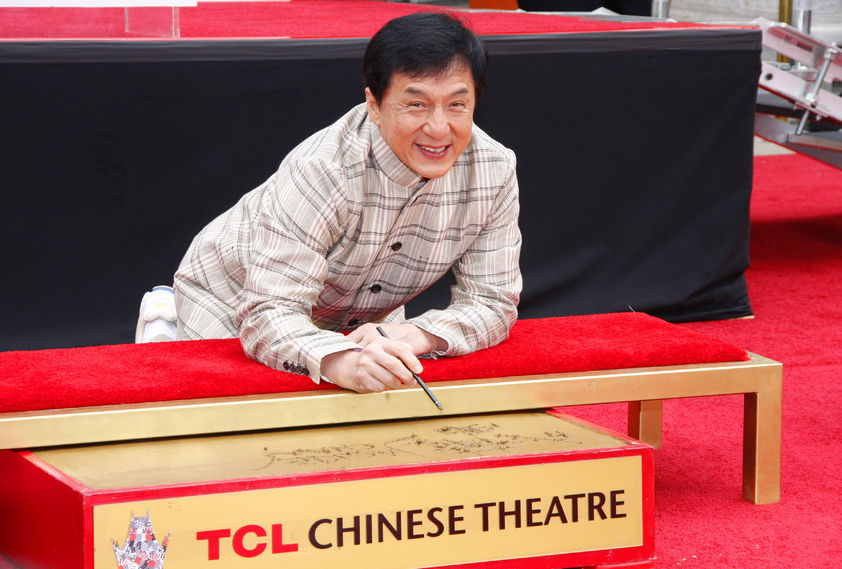 56053361 - jackie chan at the jackie chan hand and foot print ceremony held at the tcl chinese theatre in hollywood, usa on june 6, 2013.