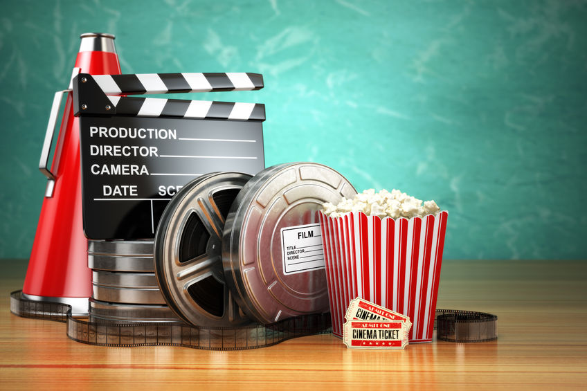 48210542 - video, movie, cinema vintage production concept. film reels, clapperboard, tickets, popcorn and megaphone. 3d