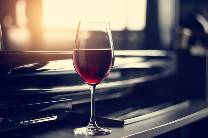 50574814 - wine glass in entertaining room among sunset window background