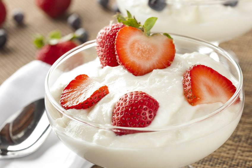 15115832 - fresh organic greek yogurt with strawberries on a background