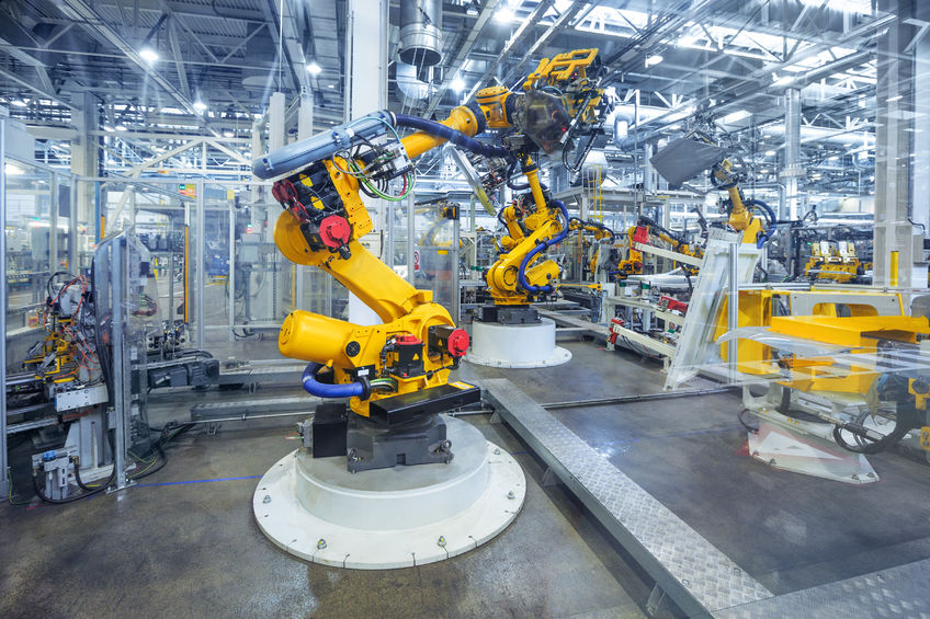 43486761 - robotic arms in a car plant