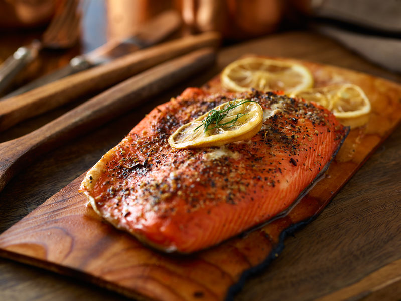 53074278 - cooked salmon fillet on top of wooden cedar plank