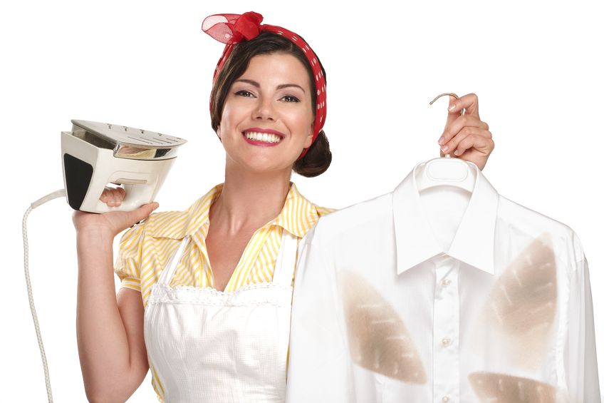 20888601 - happy beautiful woman housewife ironing a shirt on white