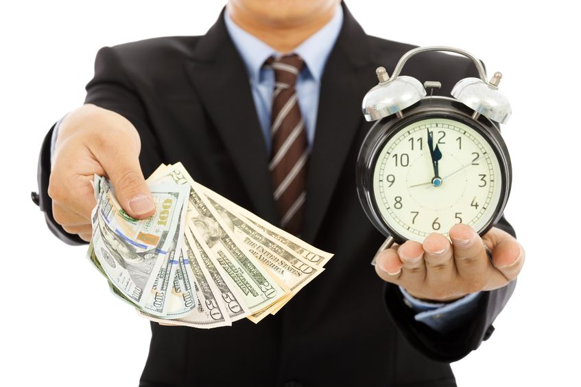 30531305 - businessman holding money and clock