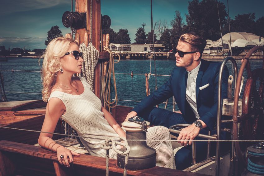 42859889 - stylish wealthy couple on a luxury yacht