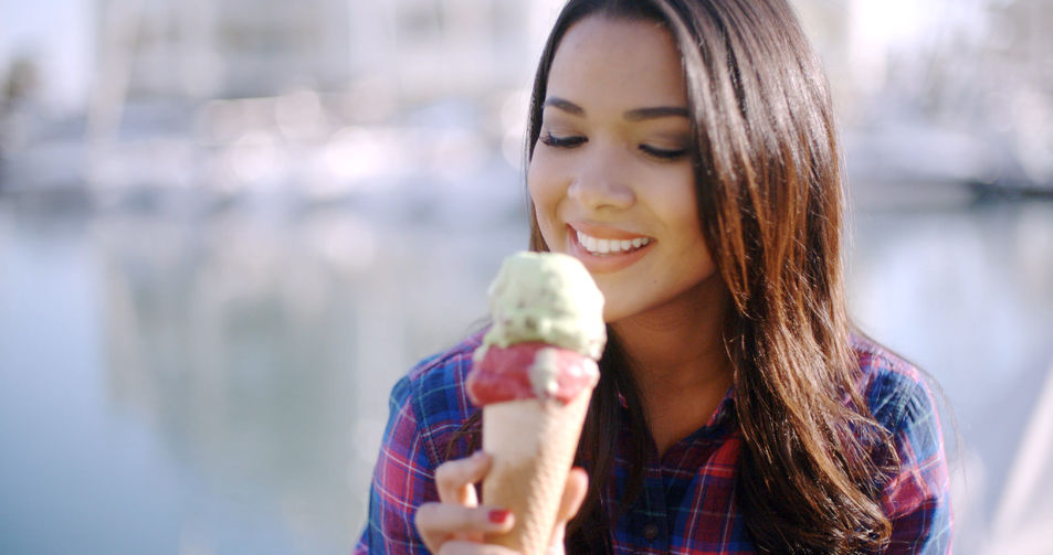 49123272 - girl eating a delicious ice cream in summer hot weather