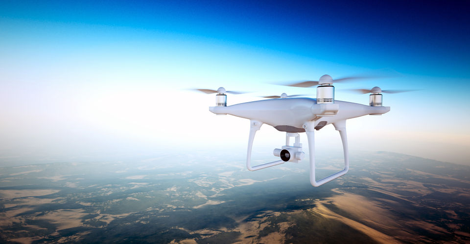 57836140 - photo white matte generic design air drone with action camera flying sky under earth surface.uninhabited desert mountains sunset background.horizontal,front top angle view.film effect. 3d rendering