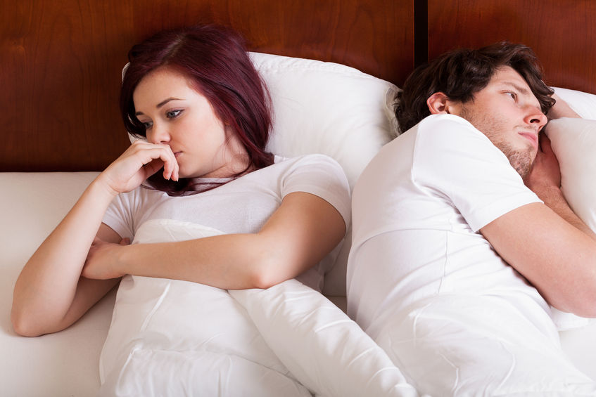 29804657 - people lying together but separately because of marital problems