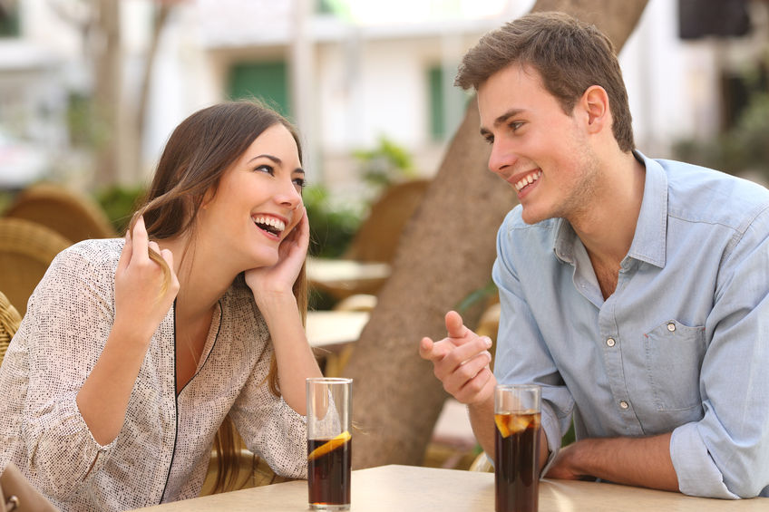 37920148 - couple dating and flirting while taking a conversation and looking each other in a restaurant
