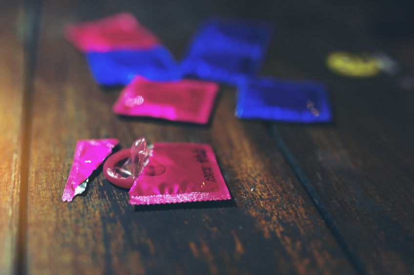 71293195 - condoms in liquor stores in angle of image blur ,world aids day