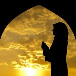 13547973 – silhouette of female muslim praying in mosque during sunset time