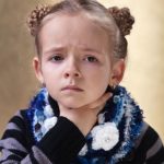 25210635 – little girl with sore throat looking sad