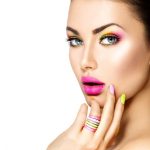 36332737 – beauty girl with colorful makeup, nail polish and accessories