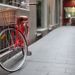 A,Shoppers,Red,Commuting,Bicycle,With,Basket,Is,Parked,In